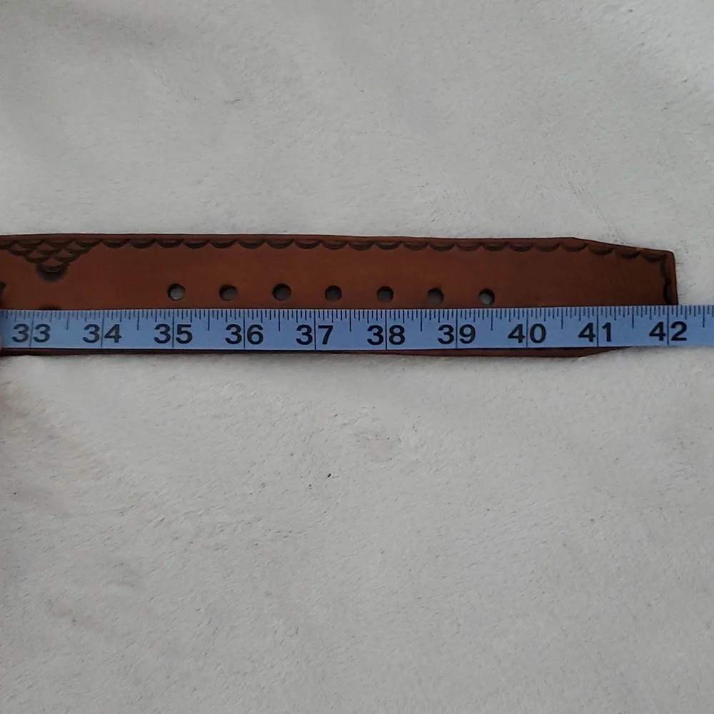 Vintage Leather Belt With Eagle Buckle and Details Embossed Along the Strap.